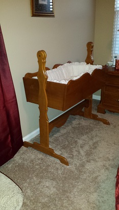 A cradle I made for our first daughter 15 years ago and now being used by our newest addition.